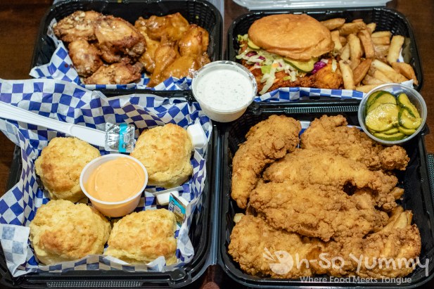 Boss Bird Kitchen to go order with chicken sandwich, wings, and tenders