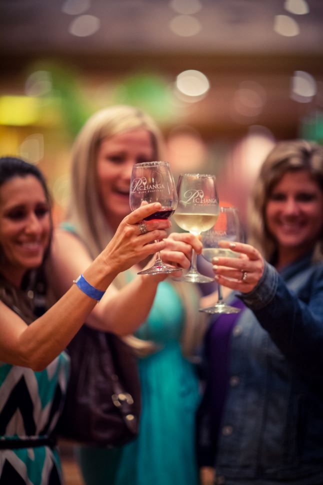 Pechenga Wine Festival toasting with a glass of wine Pechenga Wine Festival toasting with a glass of wine