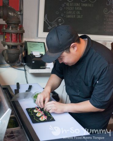 prepping tasty bites at Fishmonger's Market in San Diego prepping tasty bites at Fishmonger's Market in San Diego