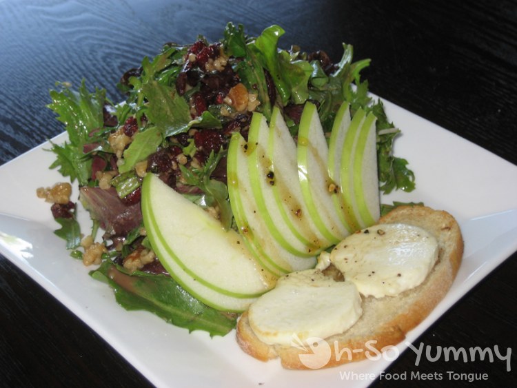 Warm Goat Cheese Salad with Crostini, Spring Mix, Apple, Walnut and Peppered Honey Warm Goat Cheese Salad with Crostini, Spring Mix, Apple, Walnut and Peppered Honey