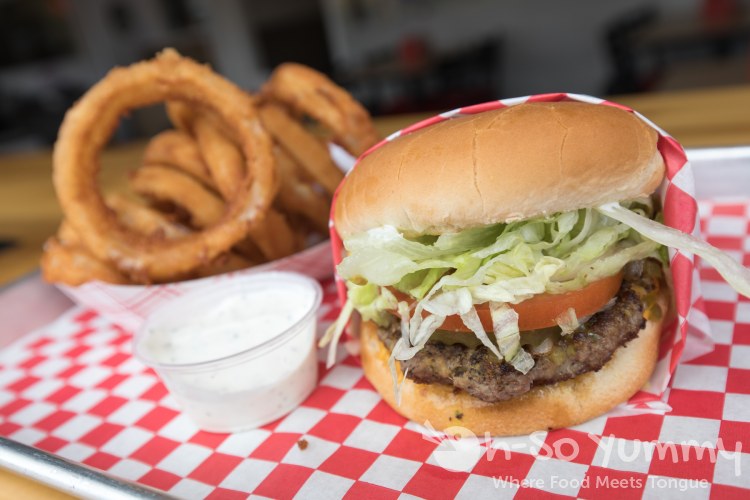 Hamburger with Onion Rings at Biggie's Burgers in Pacific Beach of San Diego Hamburger with Onion Rings at Biggie's Burgers in Pacific Beach of San Diego
