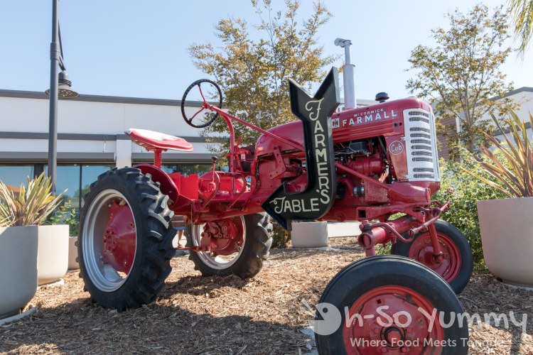 red tractor at Farmer's Table Bay Park in San Diego red tractor at Farmer's Table Bay Park in San Diego
