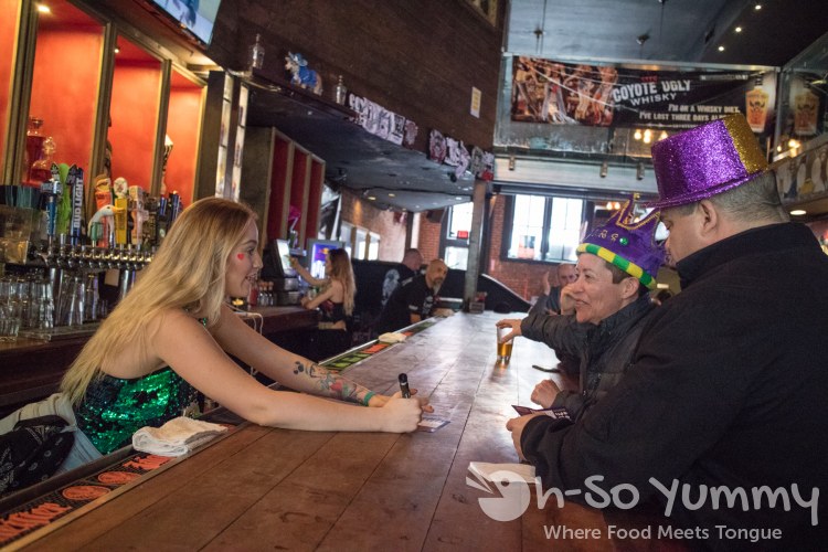 Coyote Ugly serves customers for Gaslamp Mardi Gras Beads Bites and Booze Tour Coyote Ugly serves customers for Gaslamp Mardi Gras Beads Bites and Booze Tour