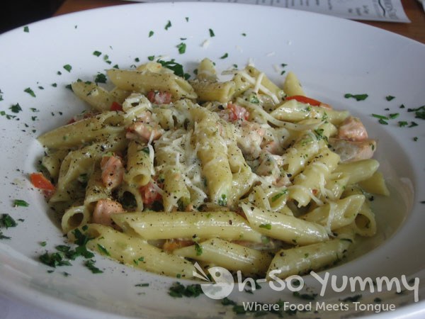McCormick and Schmick's Salmon and Penne Pasta Tossed with Pesto Cream Sauce and Tomatoes McCormick and Schmick's Salmon and Penne Pasta Tossed with Pesto Cream Sauce and Tomatoes