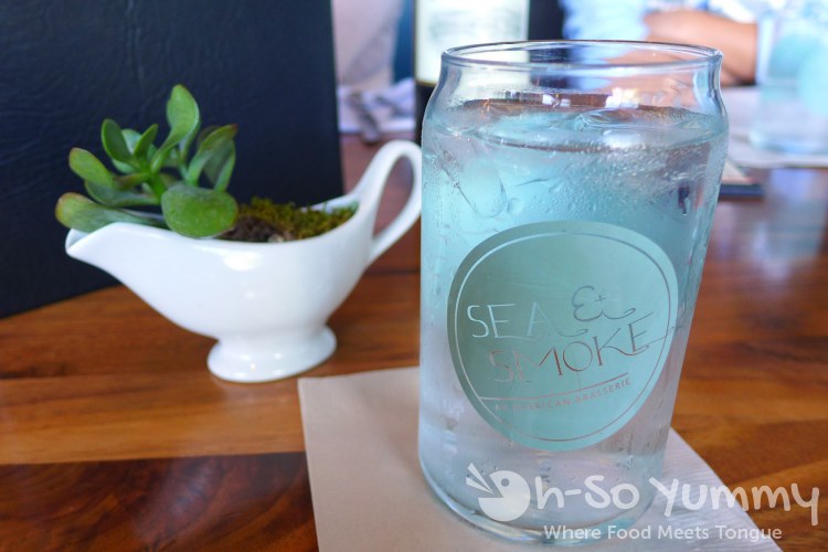 custom frosted blue drinking glass at Sea and Smoke restaurant custom frosted blue drinking glass at Sea and Smoke restaurant