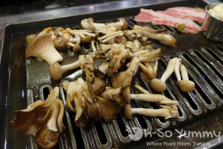 Tsuruhashi Japanese BBQ - grilling mushrooms and beef Tsuruhashi Japanese BBQ - grilling mushrooms and beef