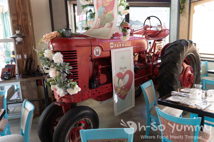 red tractor inside Farmer's Table restaurant in Little Italy red tractor inside Farmer's Table restaurant in Little Italy