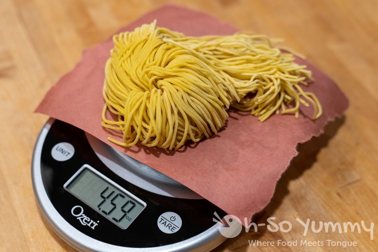 Single serving of ramen on a weight scale Single serving of ramen on a weight scale