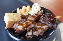 Three Meats and Three Sides Combo Plated at Sque BBQ
